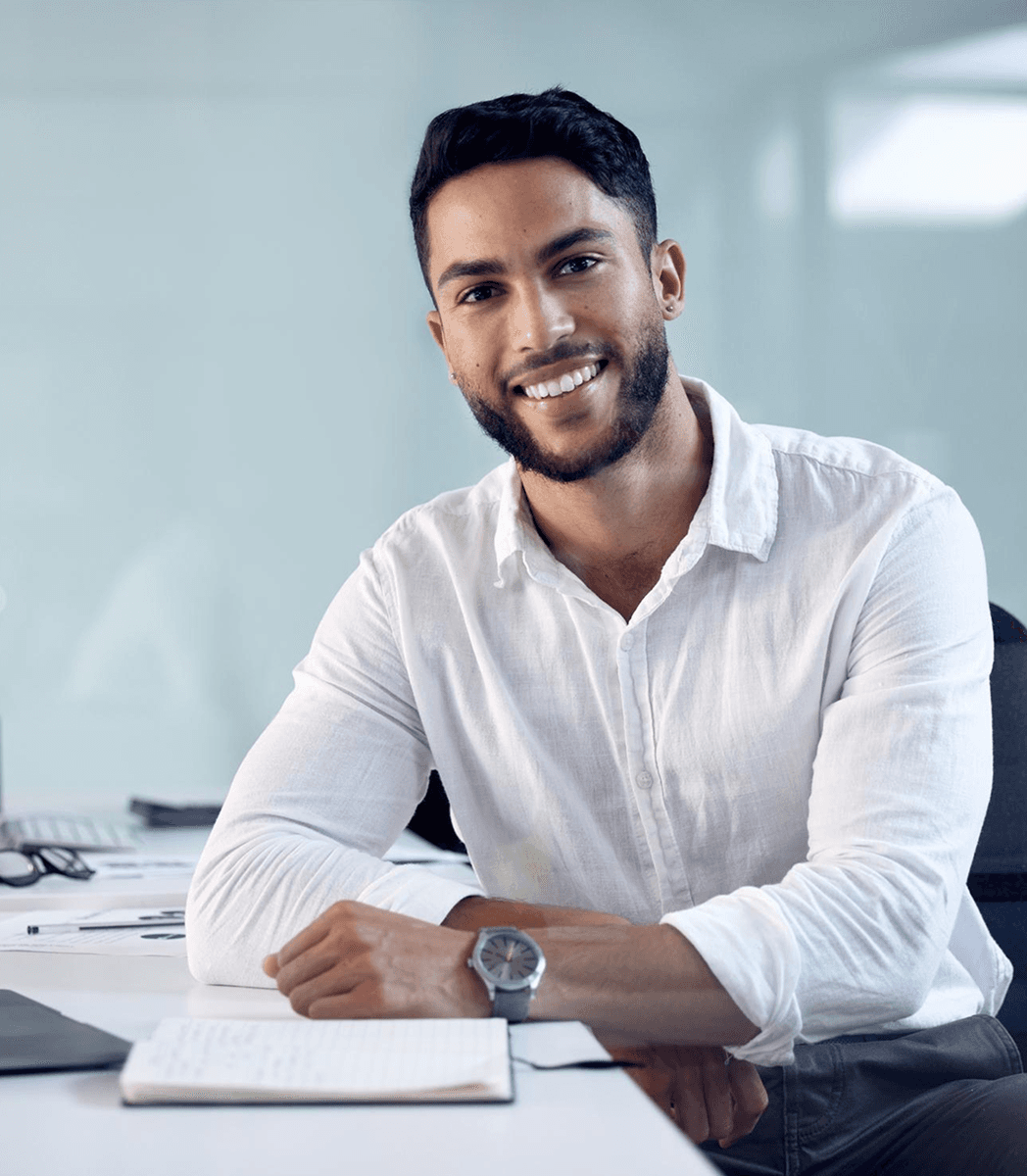 Person smiling at desk
